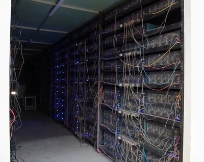 Modern Bitcoin mining farm with rows of top-tier mining machines