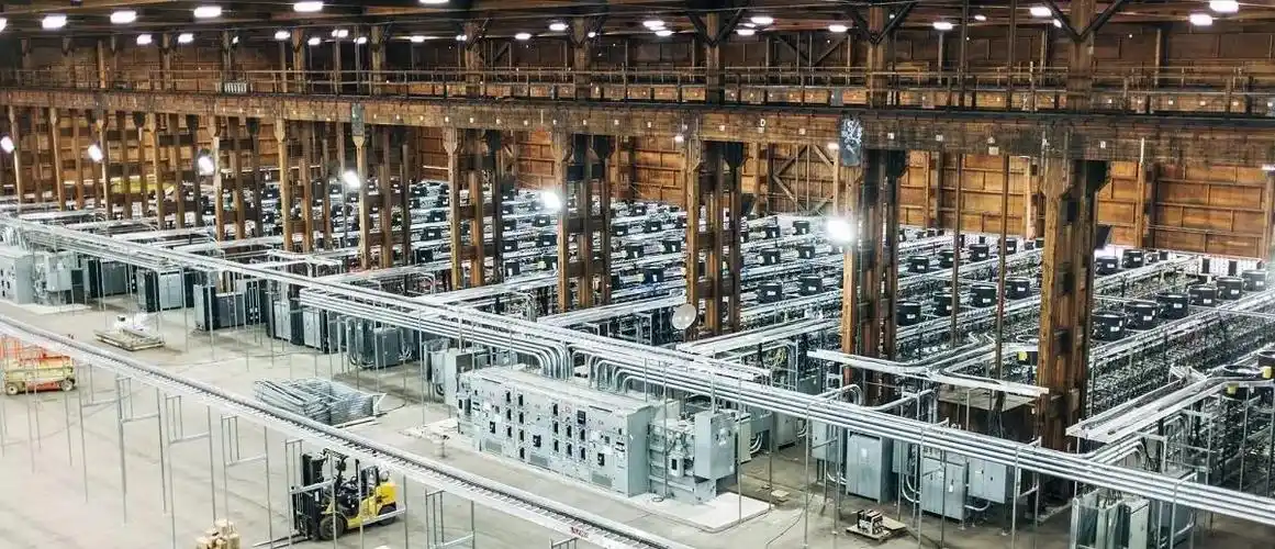 Rows of mining rigs efficiently cooling in a large mining farm