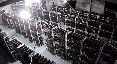 A close-up shot of a mining rig with multiple graphics cards showcases the complexity of hardware setup.